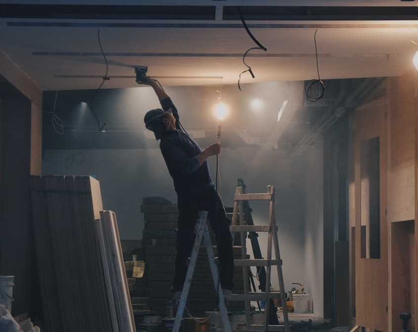 a man plastering the ceiling Man plastering the ceiling