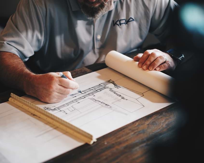 Architect Architect discussing plans for a house refurbishment project