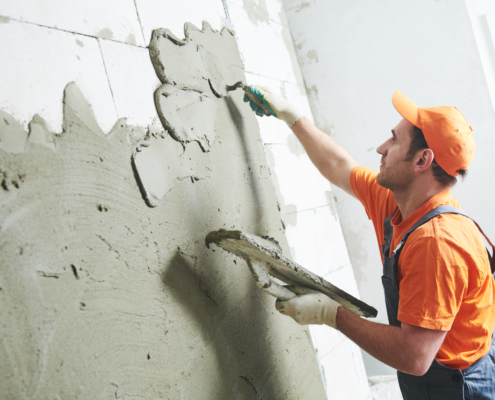 Man plastering a wall