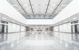 Large open white room with suspended ceiling