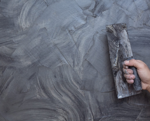 Plastering with grey Venetian Plaster