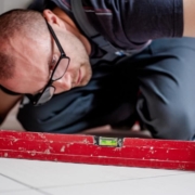Tradesperson checking a floor with a spirit level