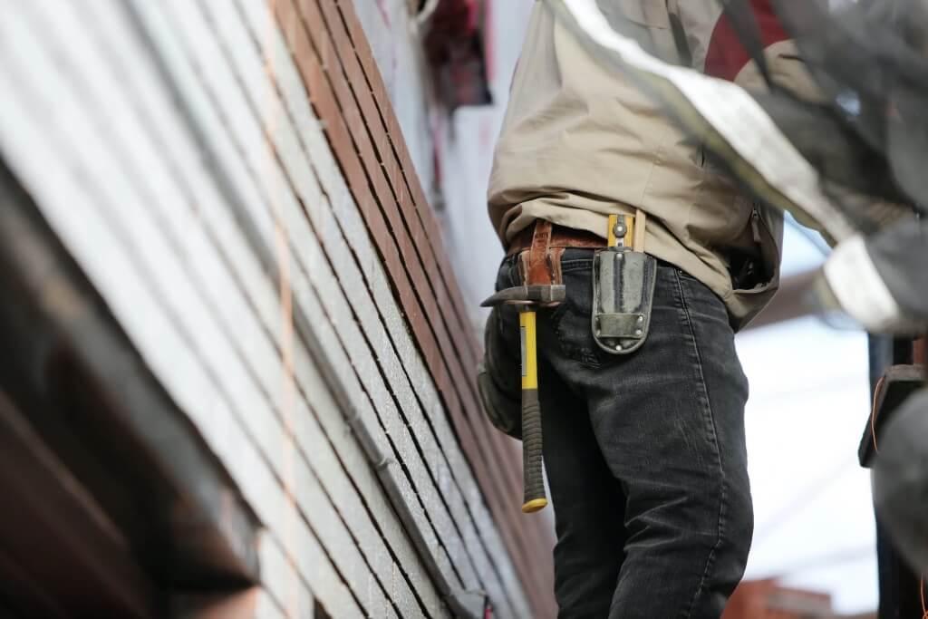 Pexels Licence - Life Of Pix.jpg Builder with a hammer in his holster